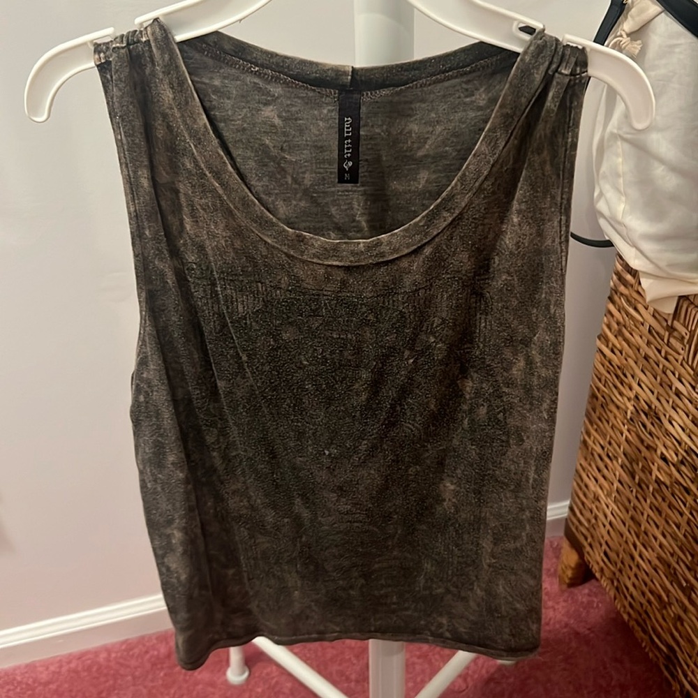 Olive green tank with a slight pattern in the background